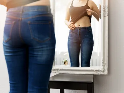 woman looking in mirror